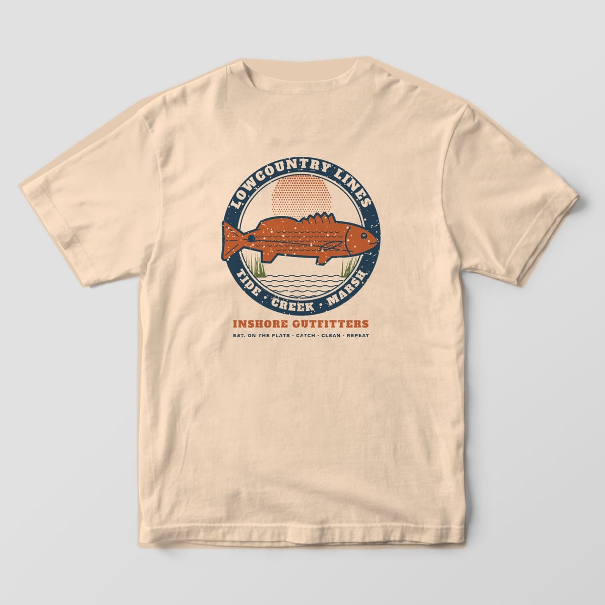 Ivory Comfort Colors tee, back view, with a large vintage redfish badge reading Lowcountry Lines, Tide Creek Marsh