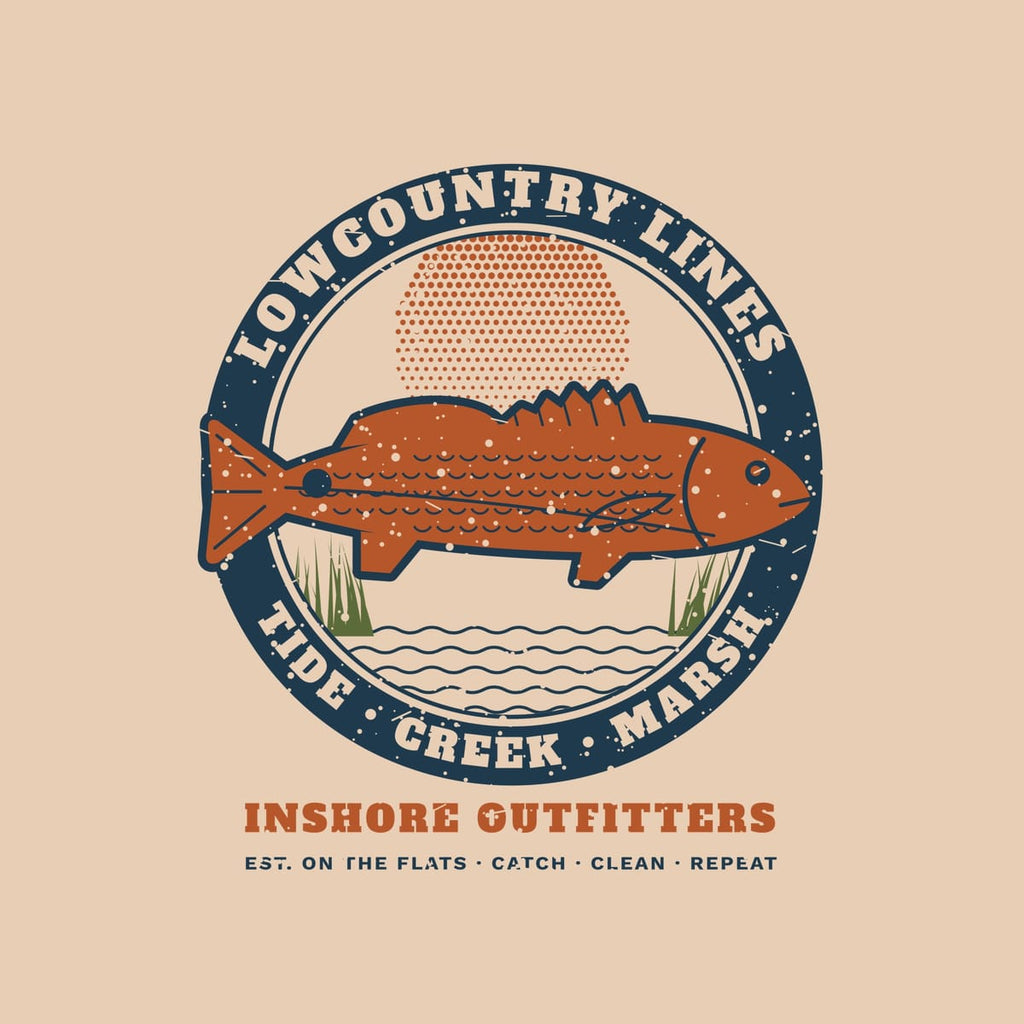 Close-up of the redfish badge print: navy ring lettering, copper redfish with scale details, halftone sun, marsh grass