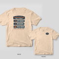 Back and front of an ivory T-shirt: back shows a vintage bait shop sign with three navy planks; front has a small oval LC patch