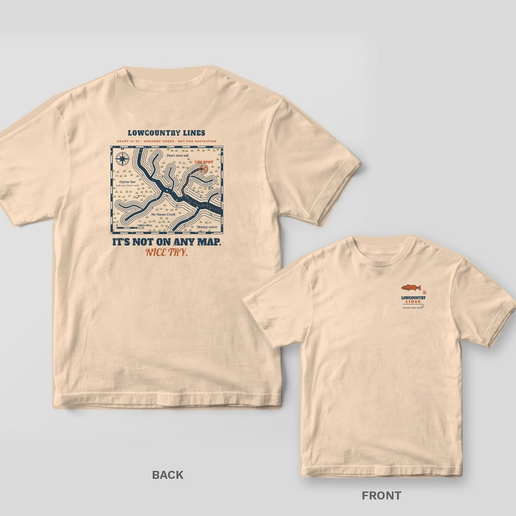 Back and front of an ivory T-shirt: back shows a vintage-style creek chart with an X marking the spot and It's Not On Any Map; front has a small redfish logo
