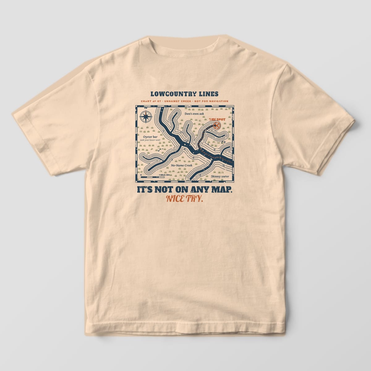 Ivory Comfort Colors tee, back view, with a navy creek map, olive marsh symbols, copper route to an X and the words Nice Try