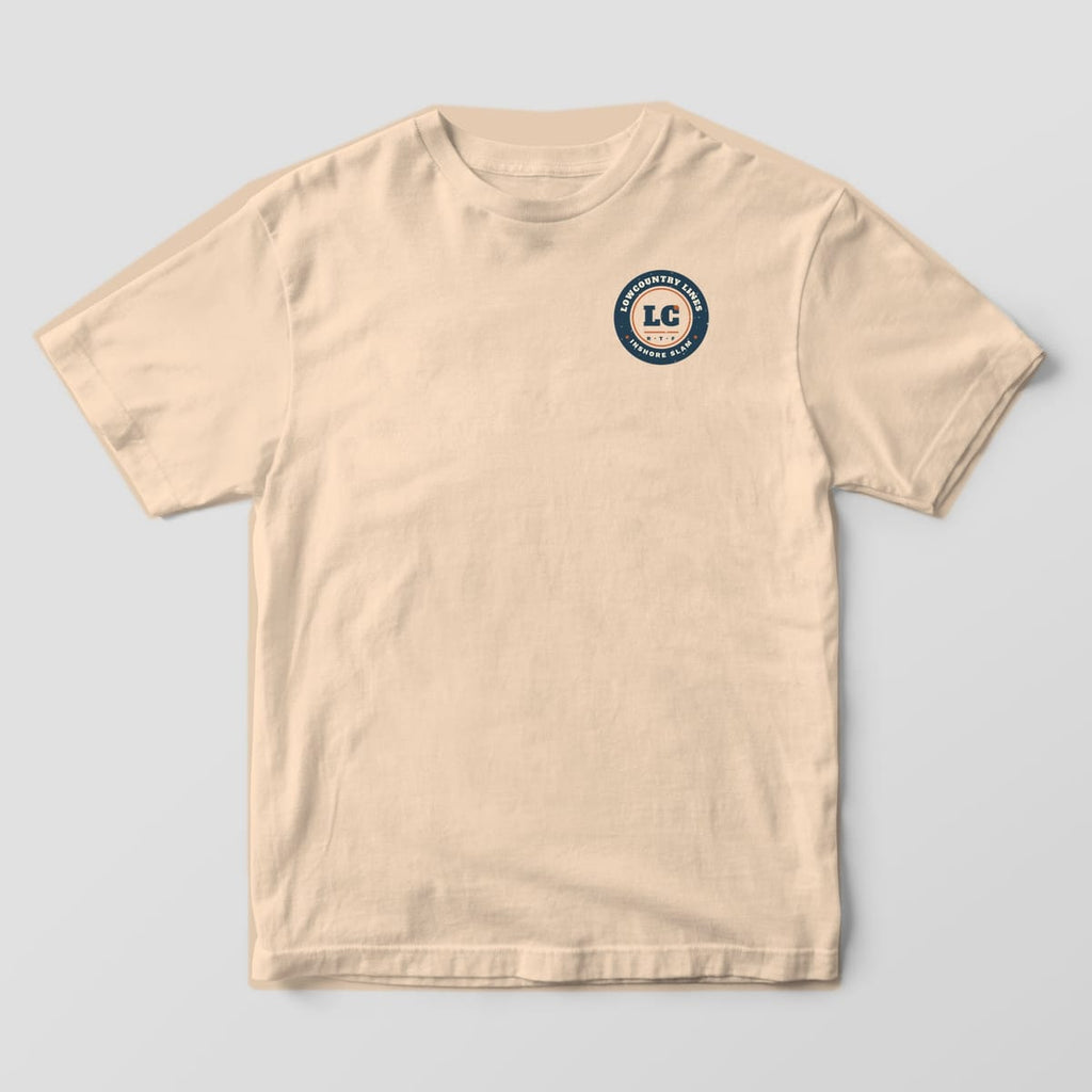 Ivory Comfort Colors tee, front view, with a small round navy Lowcountry Lines Inshore Slam badge