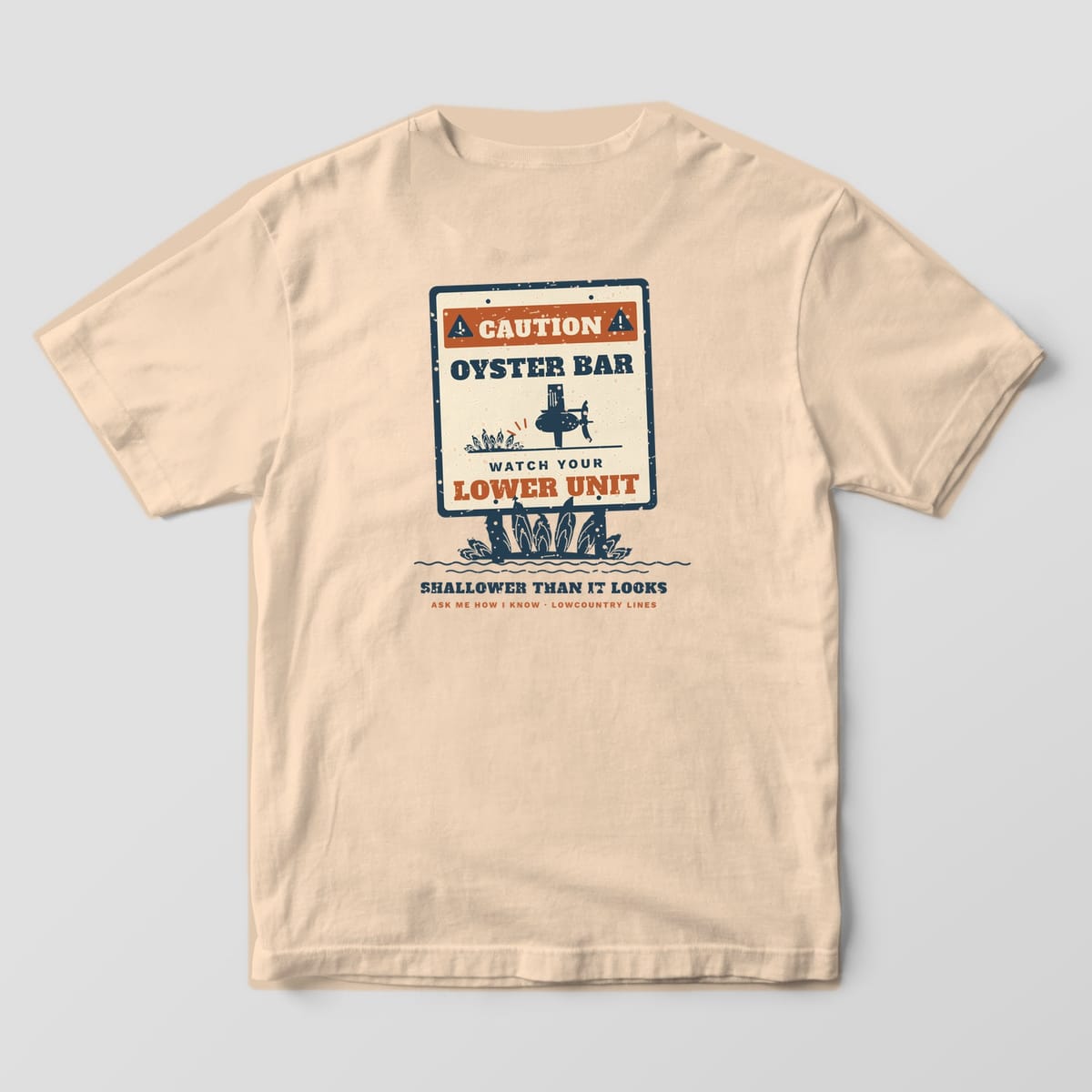 Ivory Comfort Colors tee, back view, with a navy and copper oyster bar warning sign standing in an oyster cluster
