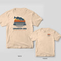 Back and front of an ivory T-shirt: back shows a navy redfish leaping over a retro striped sunset; front has a small copper redfish logo