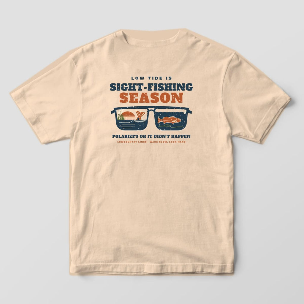 Ivory Comfort Colors tee, back view, with navy sunglasses showing a tailing redfish and an underwater redfish in the lenses