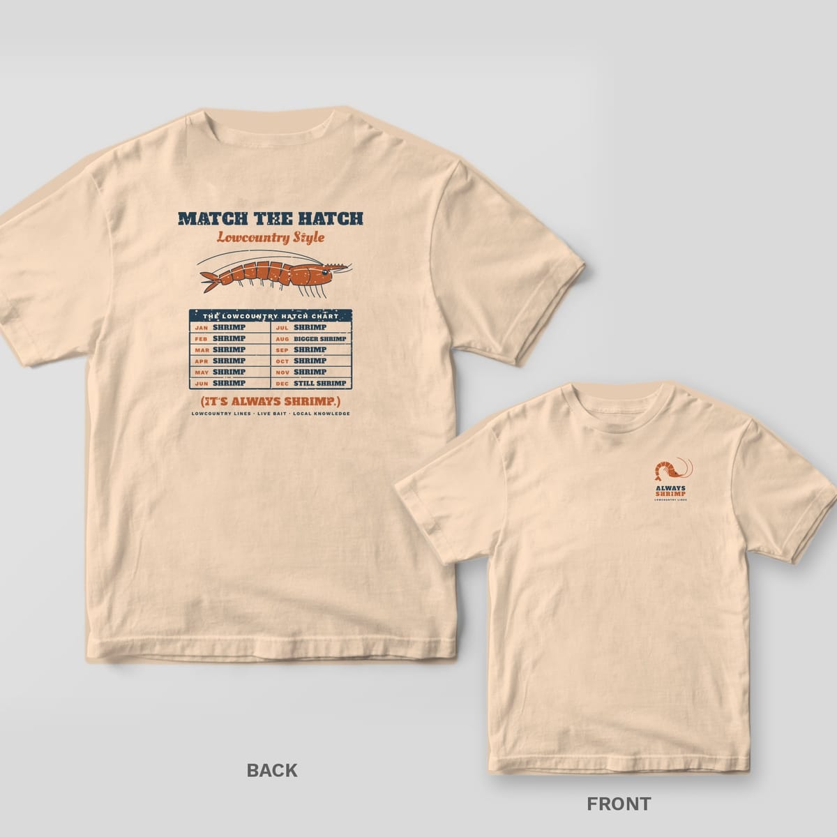 Back and front of an ivory T-shirt: back shows a shrimp illustration and a hatch chart where every month says shrimp; front has a small shrimp