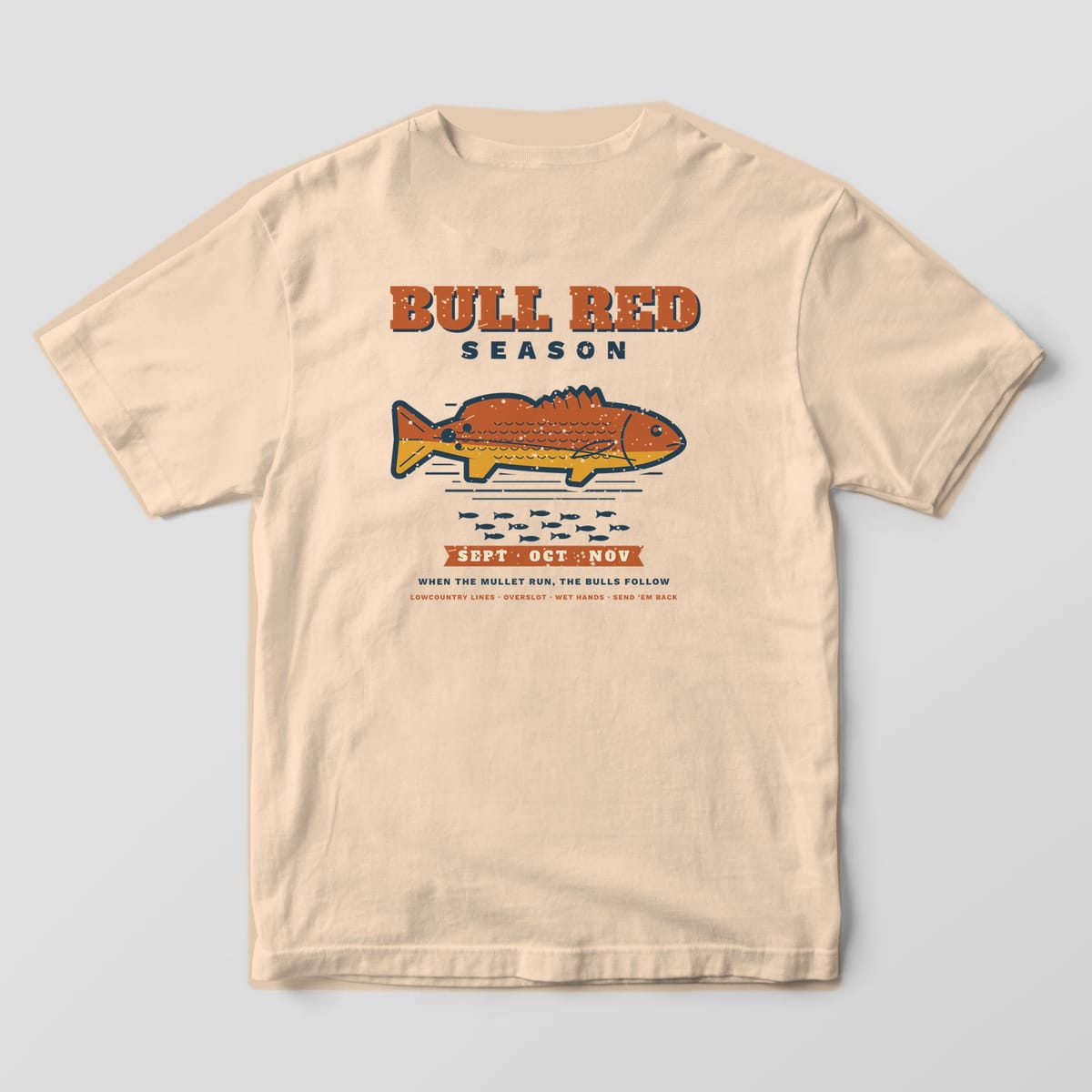 Ivory Comfort Colors tee, back view, with Bull Red Season lettering, a large redfish, a mullet school and a Sept Oct Nov ribbon