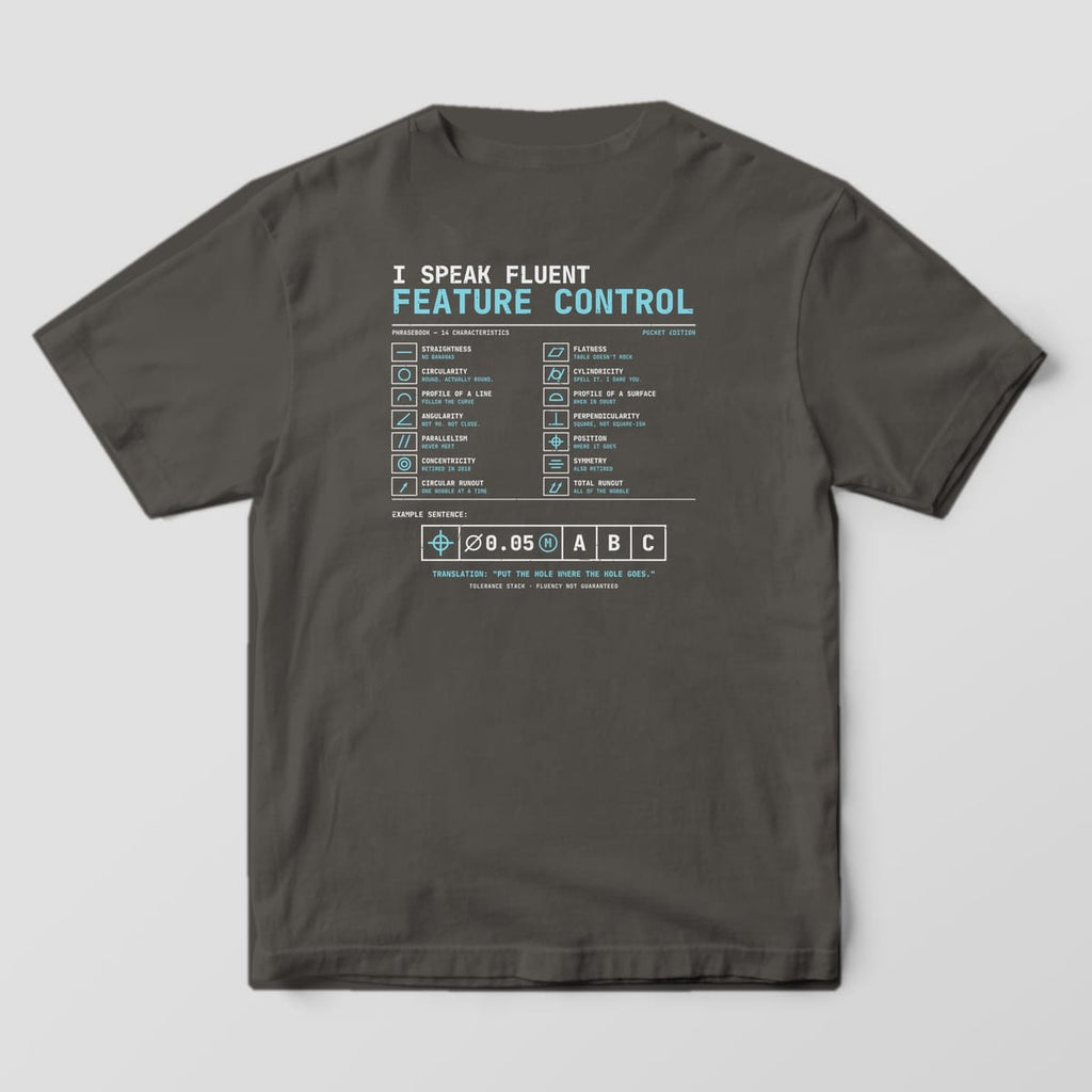 Back of a Pepper Comfort Colors 1717 tee with a cyan and off-white chart of 14 GD&T symbols with joke translations and a large feature control frame.