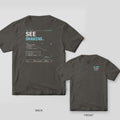 Pepper Comfort Colors tee shown back and front: See Drawing print with circular notes on the back and a small plus-minus 0.005 logo on the chest.