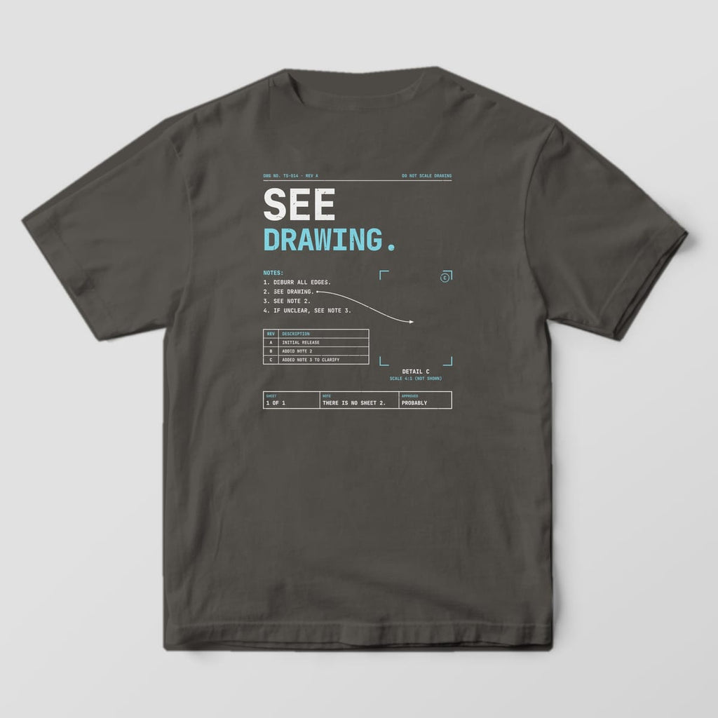 Back of a Pepper Comfort Colors 1717 tee reading See Drawing, with drawing notes, an arrow pointing to an empty detail frame and a title strip.