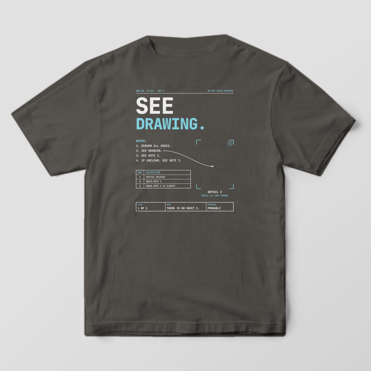 Back of a Pepper Comfort Colors 1717 tee reading See Drawing, with drawing notes, an arrow pointing to an empty detail frame and a title strip.