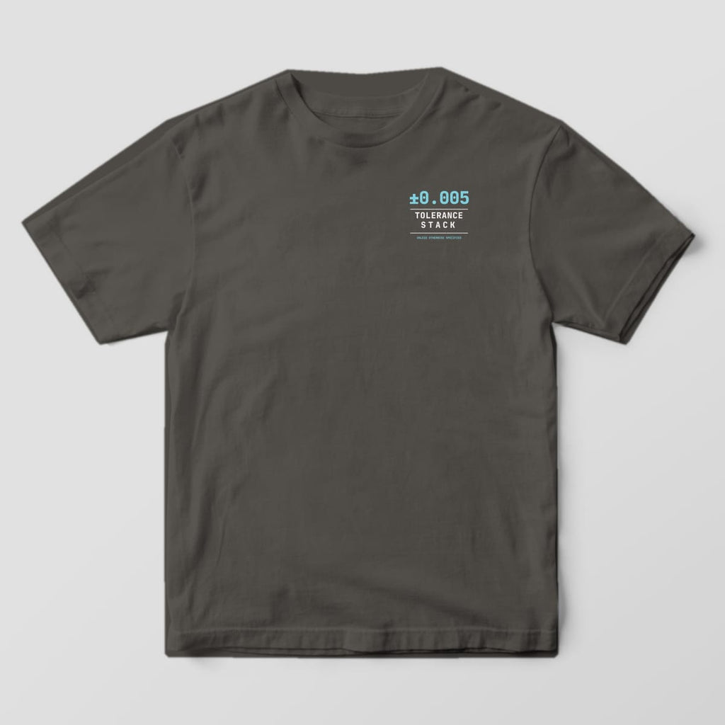 Front of a Pepper Comfort Colors 1717 tee with a small left-chest plus-minus 0.005 Tolerance Stack logo.