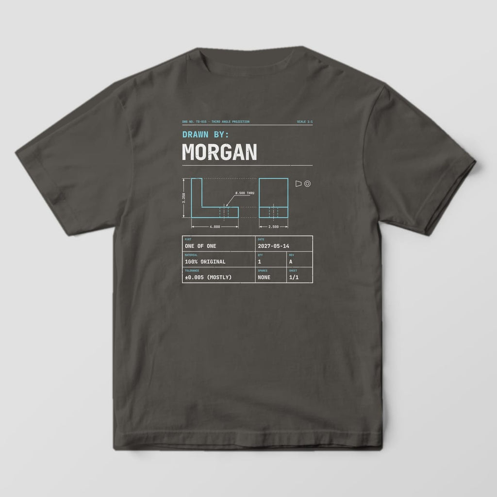 Back of a Pepper Comfort Colors 1717 tee with Drawn By: Morgan in large type, a cyan L-bracket drawing with dimensions and a title block with a sample date.