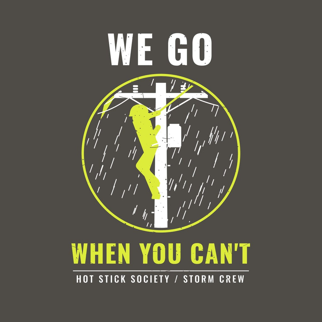Close-up of the We Go When You Can't print artwork in hi-vis yellow and white on a dark background