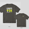 Back and front of a pepper Lights On lineman T-shirt shown together, back print large on the left and the small chest print on the right