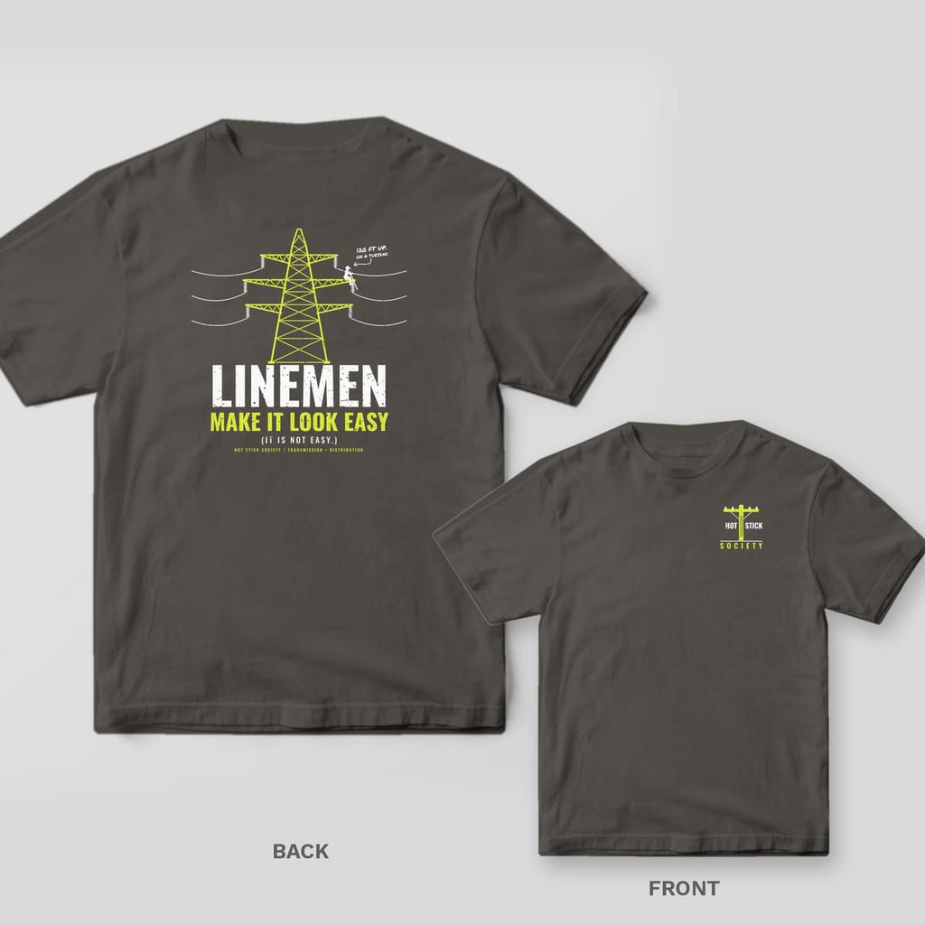 Back and front of a pepper Linemen Make It Look Easy lineman T-shirt shown together, back print large on the left and the small chest print on the right