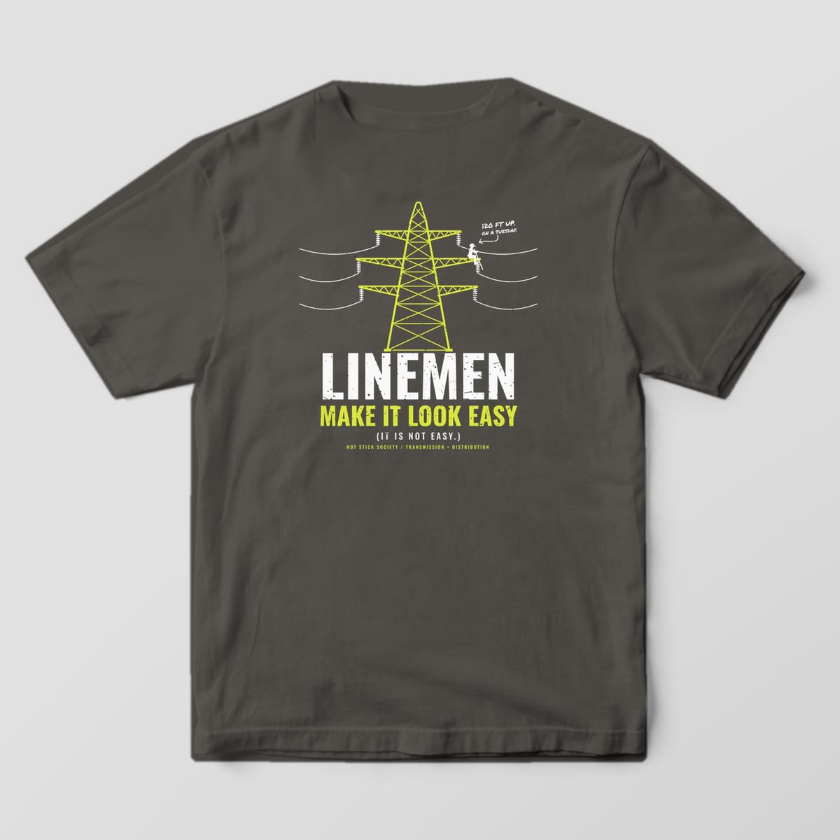 Back view of the pepper Comfort Colors 1717 shirt showing the Linemen Make It Look Easy back print in hi-vis yellow and white