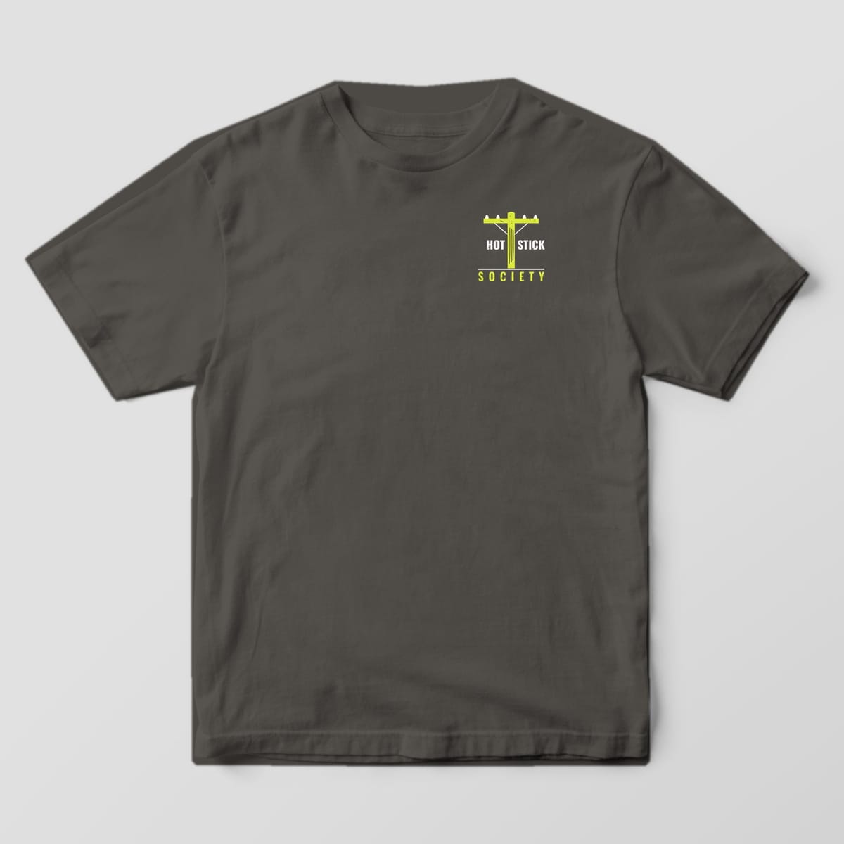 Front view of the pepper Comfort Colors 1717 shirt with the small left-chest Linemen Make It Look Easy print
