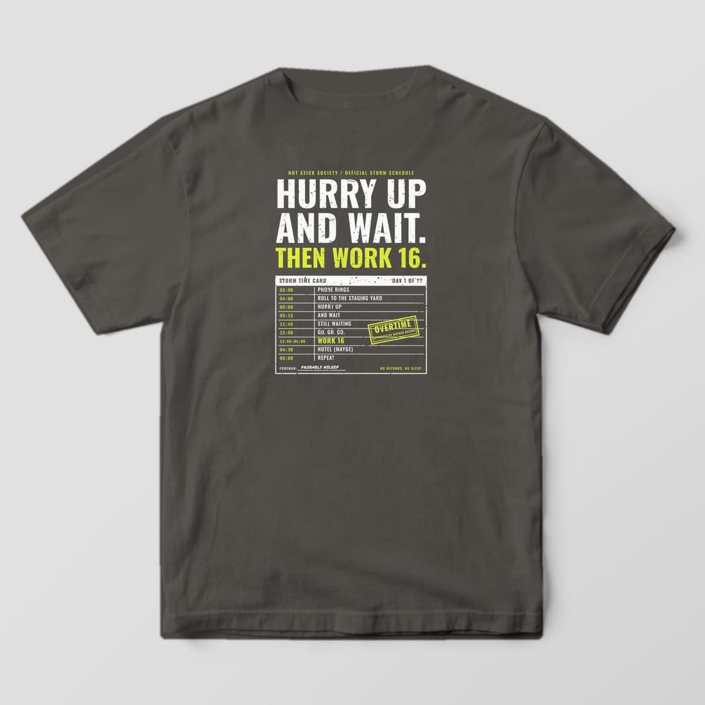 Back view of the pepper Comfort Colors 1717 shirt showing the Hurry Up and Wait Storm Time Card back print in hi-vis yellow and white