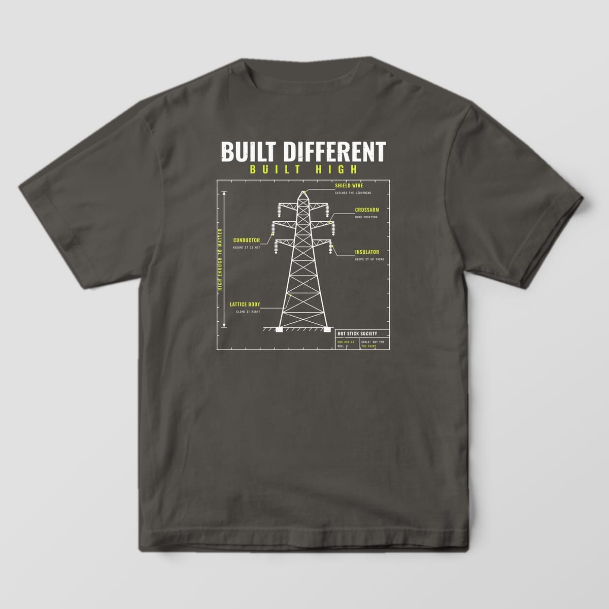 Back view of the pepper Comfort Colors 1717 shirt showing the Built Different Built High transmission tower blueprint back print in hi-vis yellow and white