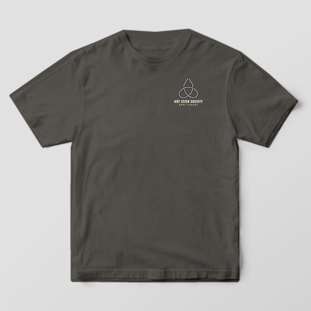Front view of the pepper Comfort Colors 1717 shirt with the small left-chest Knots of the Trade print