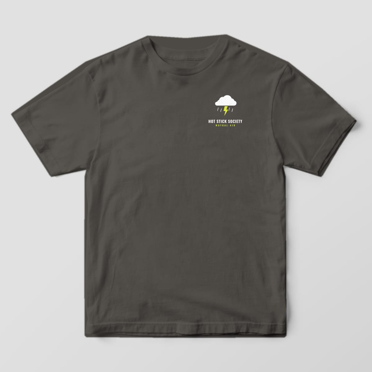 Front view of the pepper Comfort Colors 1717 shirt with the small left-chest Mutual Aid Convoy print