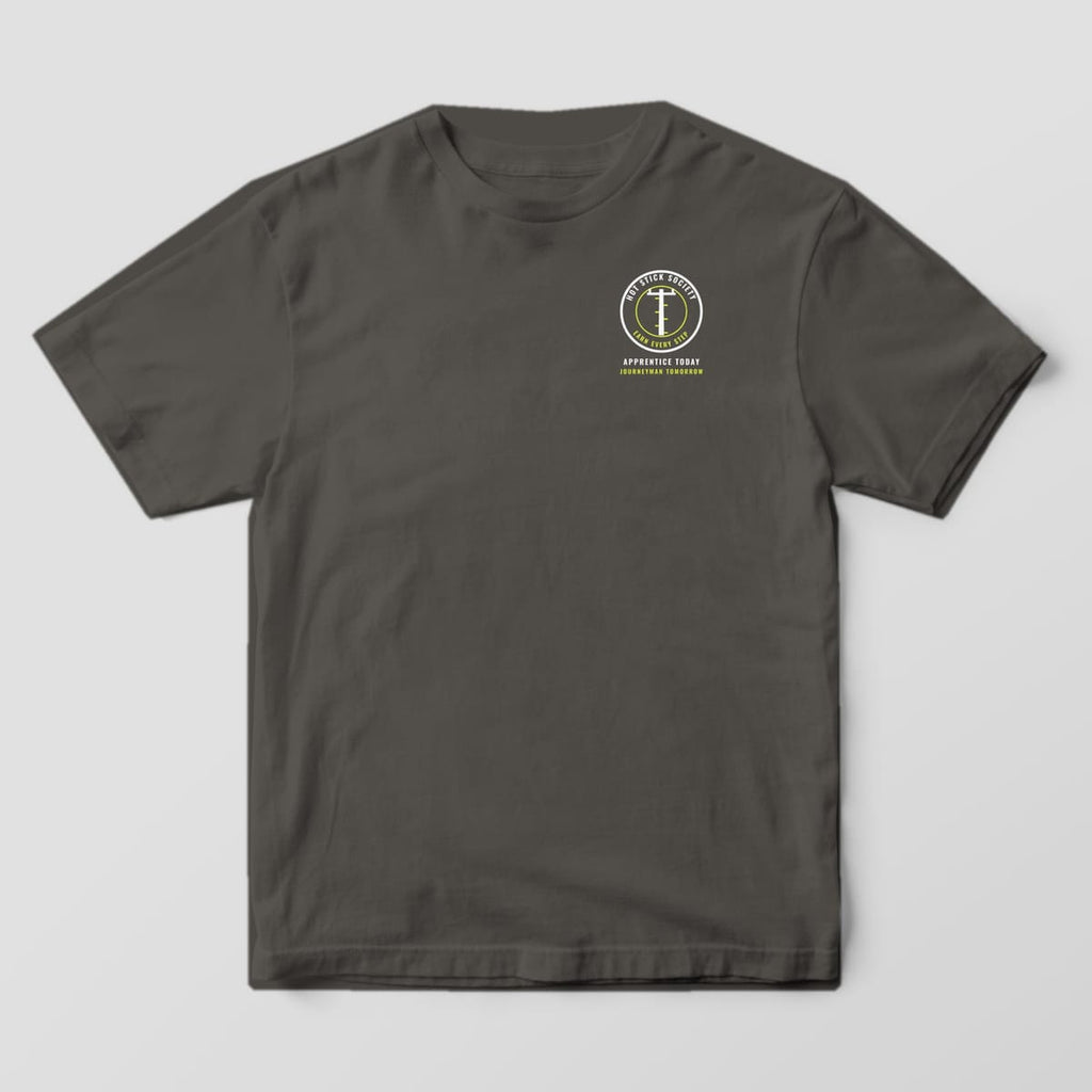 Front view of the pepper Comfort Colors 1717 shirt with the small left-chest Apprentice Today, Journeyman Tomorrow print