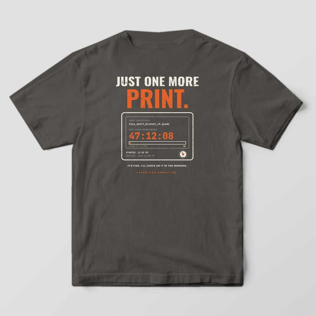 Back print on a Pepper Comfort Colors 1717 tee: "Just One More Print." over a printer status screen reading 47:12:08 remaining at layer 3 of 2,140, with "It's fine. I'll check on it in the morning."