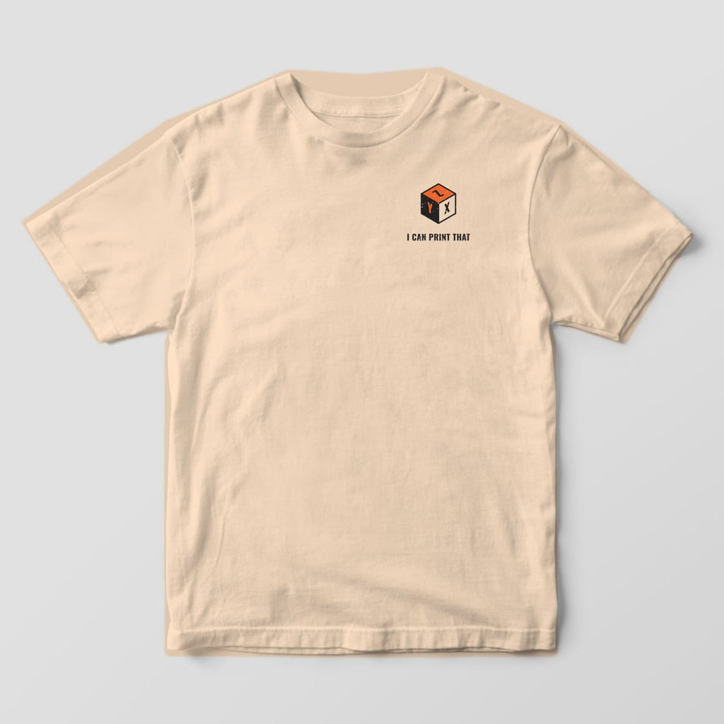 Front of the Ivory Comfort Colors 1717 tee showing the left-chest print: Small left-chest calibration cube with X, Y and Z faces and "I Can Print That"