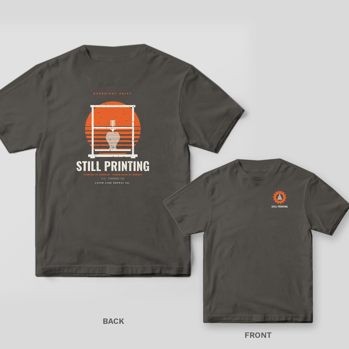 Still Printing Retro Sunset 3D printing shirt shown back and front on Pepper Comfort Colors 1717: "Overnight Shift" over a striped orange sunset framed by a printer gantry with a half-printed vase, "Still Printing" in bold below