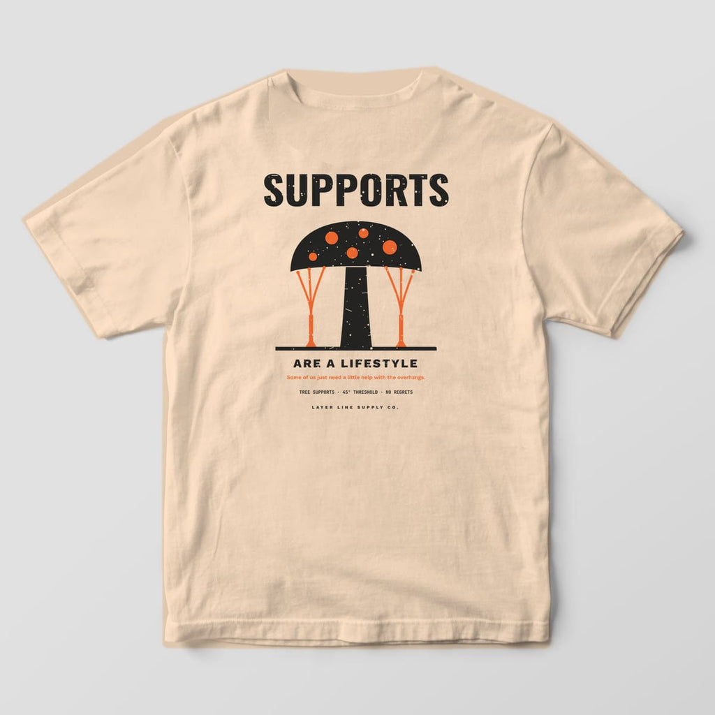Back print on an Ivory Comfort Colors 1717 tee: Big "Supports" over a mushroom-shaped print on branching orange tree supports, "Are a Lifestyle" below with "Tree Supports · 45° Threshold · No Regrets"