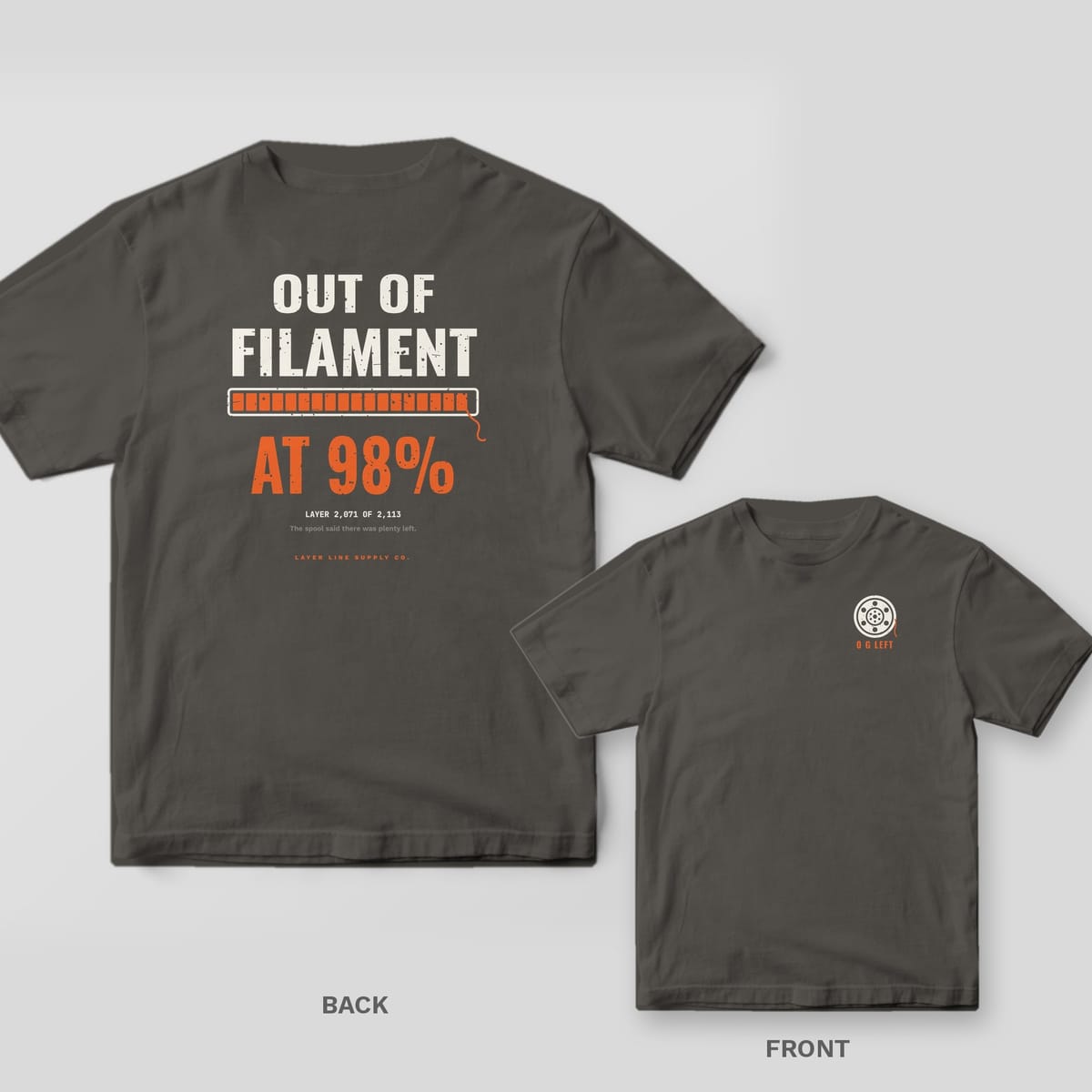 Out of Filament at 98 Percent 3D printing shirt shown back and front on Pepper Comfort Colors 1717: "Out of Filament" over an orange progress bar stopped at 98% with a dangling filament end, "At 98%" in big orange type and "Layer 2,071 of 2,113"