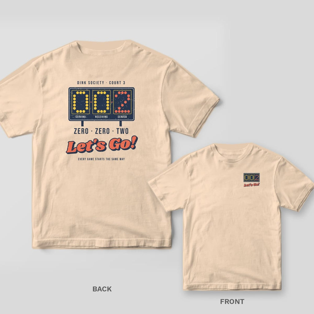 Zero Zero Two, Let's Go pickleball shirt shown back and front on Ivory Comfort Colors 1717: Navy retro scoreboard reading 0-0-2 in yellow and coral dots with Zero Zero Two Let's Go text