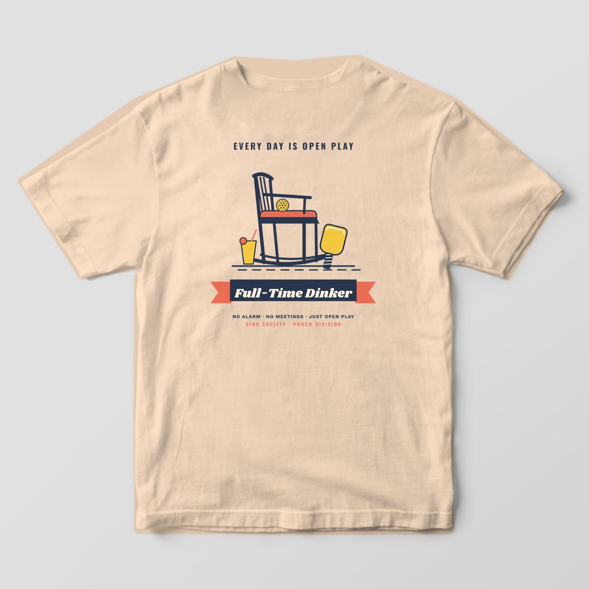 Back print on an Ivory Comfort Colors 1717 tee: Navy rocking chair with a pickleball, yellow paddle and lemonade over a Full-Time Dinker banner