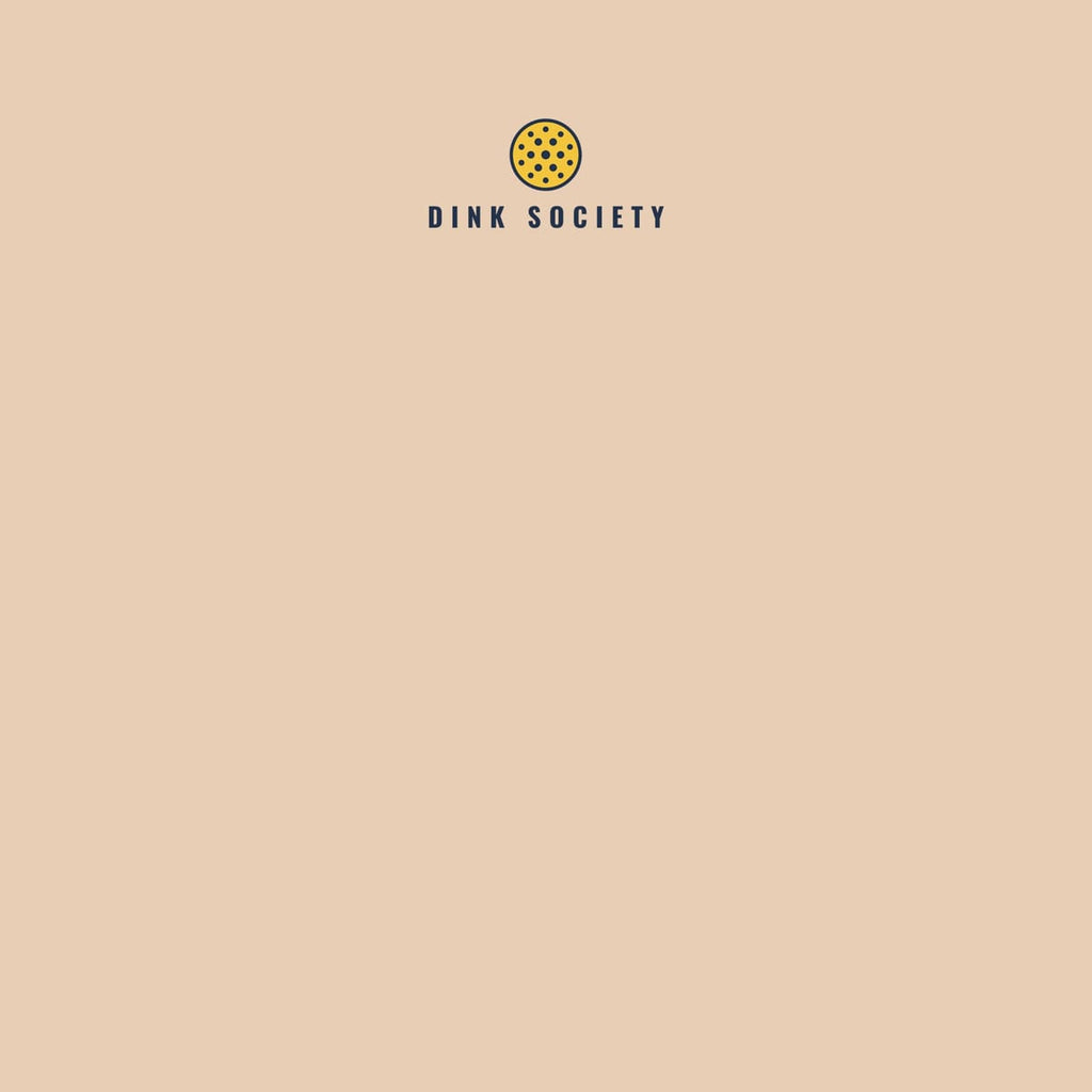 Close-up of the Dink Society Wave print showing navy, coral and yellow ink detail