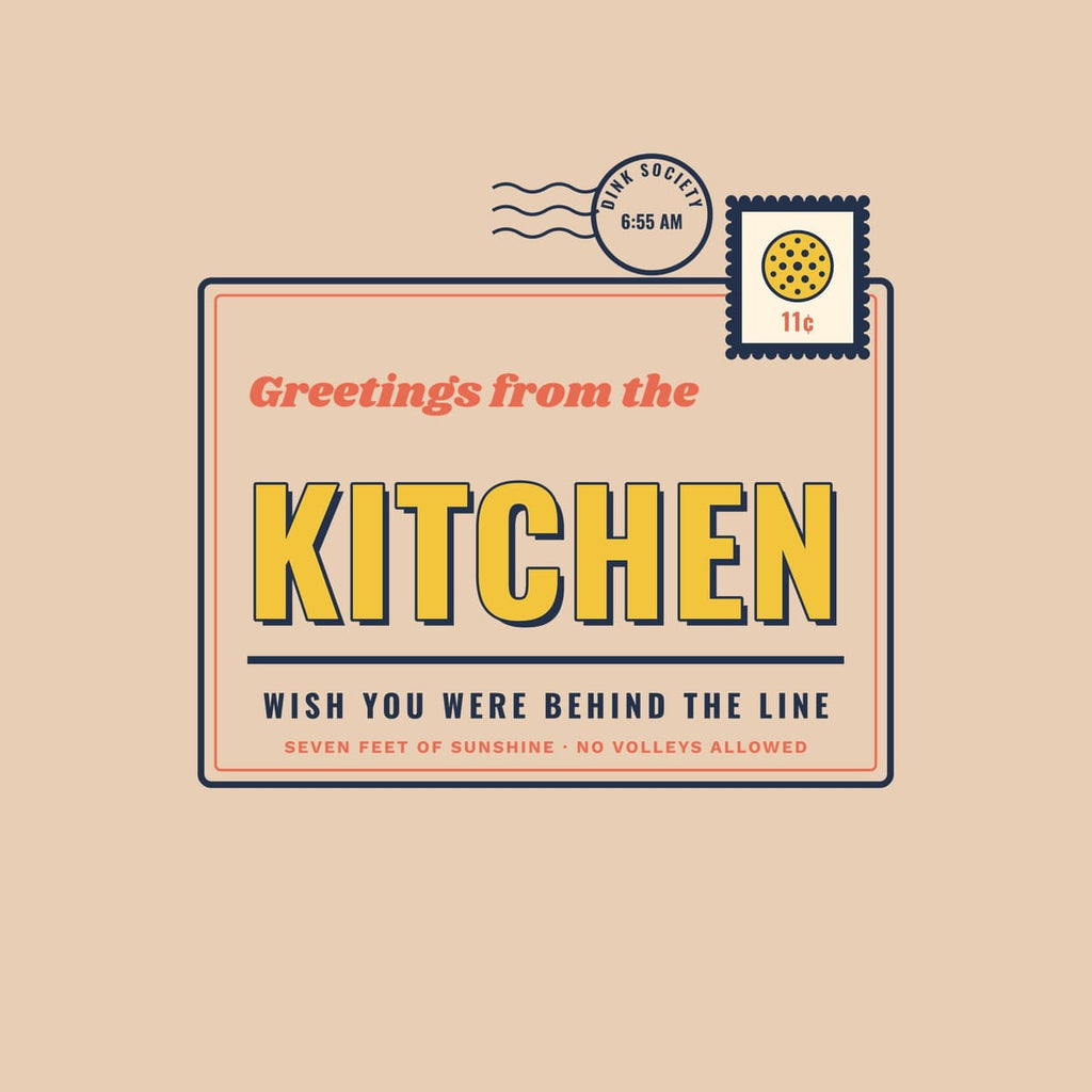 Close-up of the Greetings from the Kitchen print showing navy, coral and yellow ink detail
