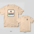 Pickled pickleball shirt shown back and front on Ivory Comfort Colors 1717: Vintage pickle jar label reading Pickled, Aged on Hard Courts with crossed coral and green paddles