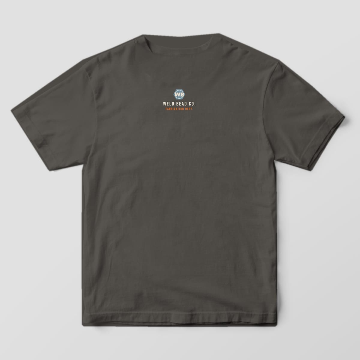 Back print on a Pepper Comfort Colors 1717 tee: Small back-neck hex nut "WB" logo with "Weld Bead Co." and "Fabrication Dept."