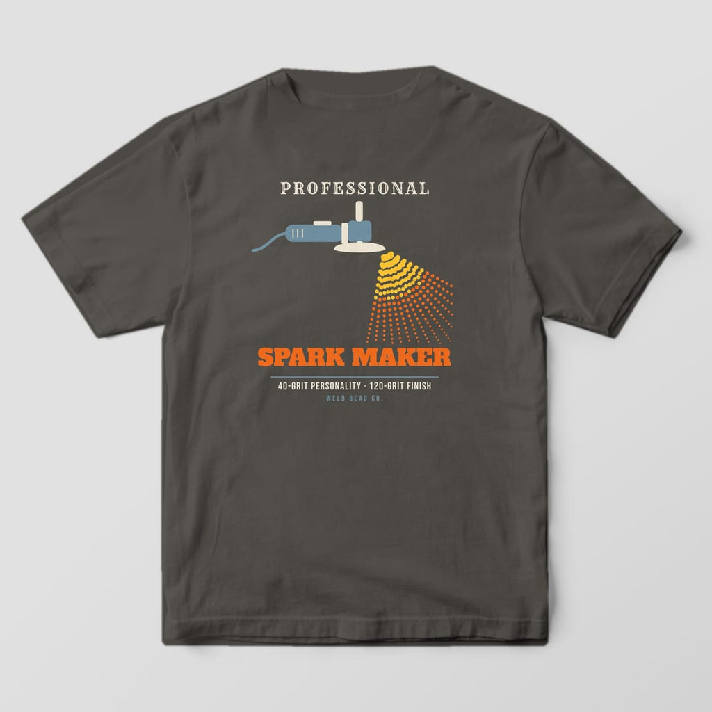 Back print on a Pepper Comfort Colors 1717 tee: "Professional Spark Maker" with an angle grinder throwing a halftone fan of yellow and orange sparks, plus "40-Grit Personality · 120-Grit Finish"