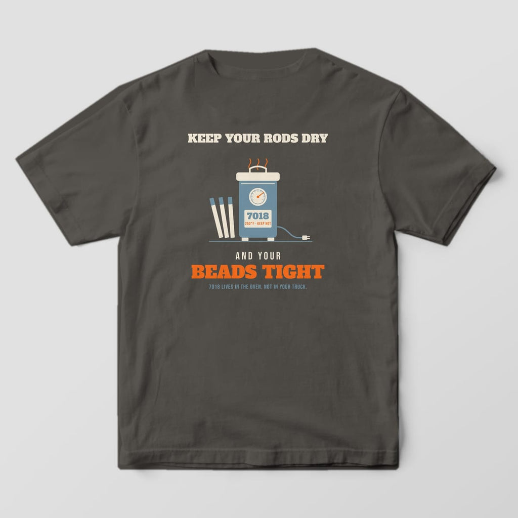 Back print on a Pepper Comfort Colors 1717 tee: A rod oven with a temperature gauge and electrodes under "Keep Your Rods Dry", with "And Your Beads Tight" and "7018 Lives in the Oven. Not in Your Truck."