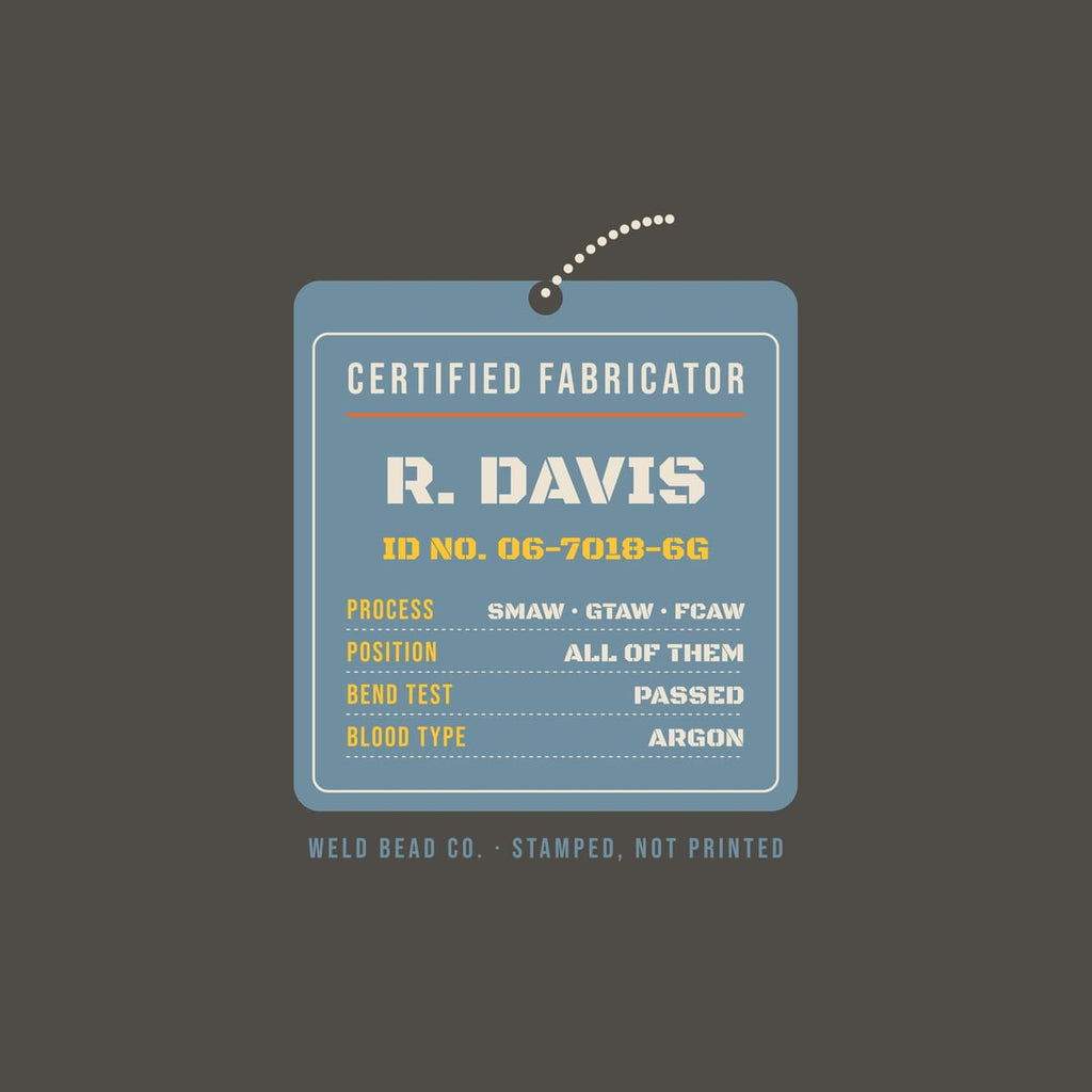 Close-up of the Certified Fabricator Tag (custom name) print showing bone, arc orange and steel blue ink detail
