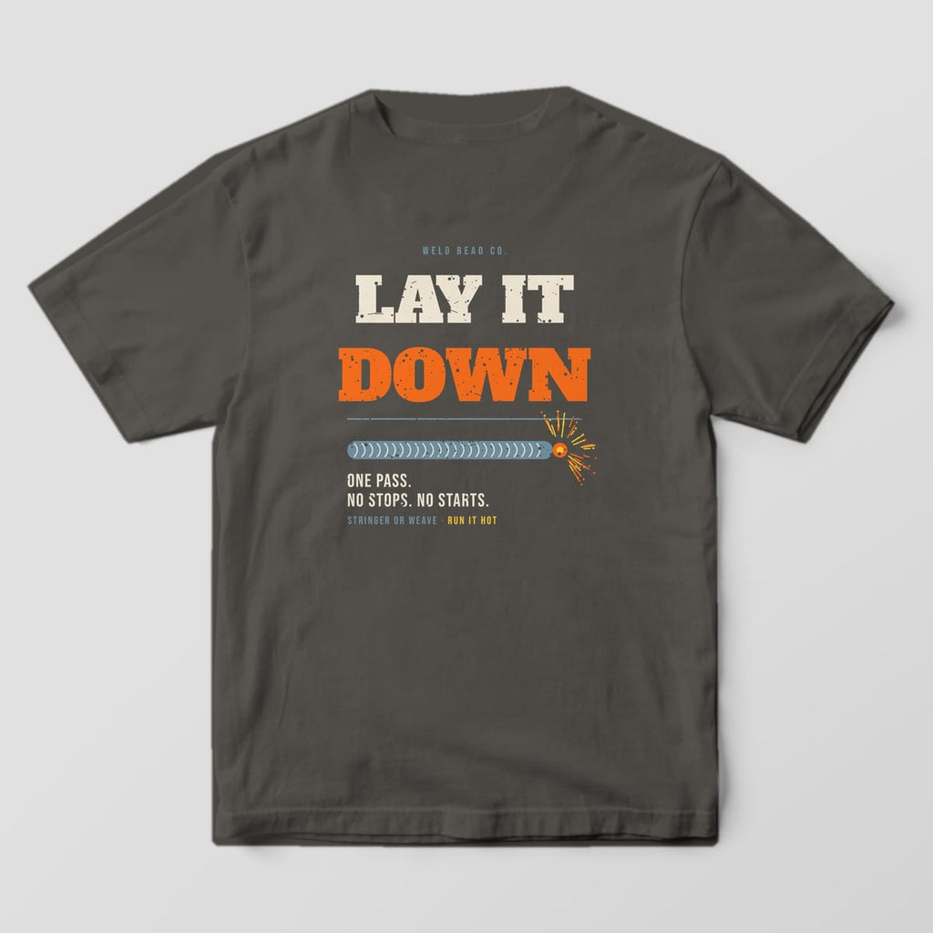 Back print on a Pepper Comfort Colors 1717 tee: "Lay It Down" in large distressed slab type over a long stacked-dime bead ending in sparks, with "One Pass. No Stops. No Starts."