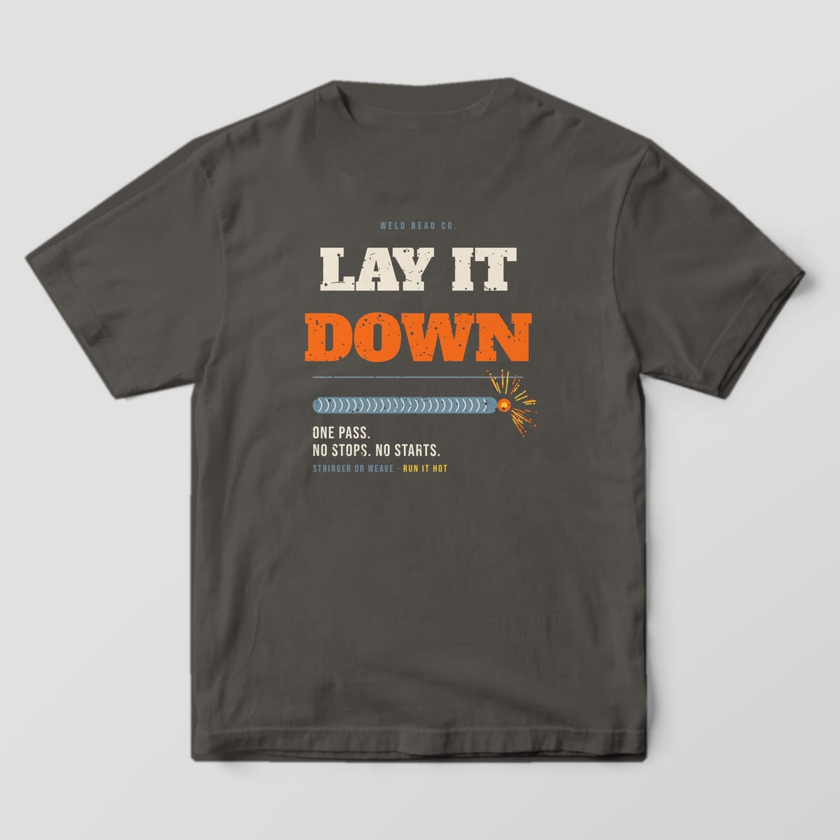 Back print on a Pepper Comfort Colors 1717 tee: "Lay It Down" in large distressed slab type over a long stacked-dime bead ending in sparks, with "One Pass. No Stops. No Starts."