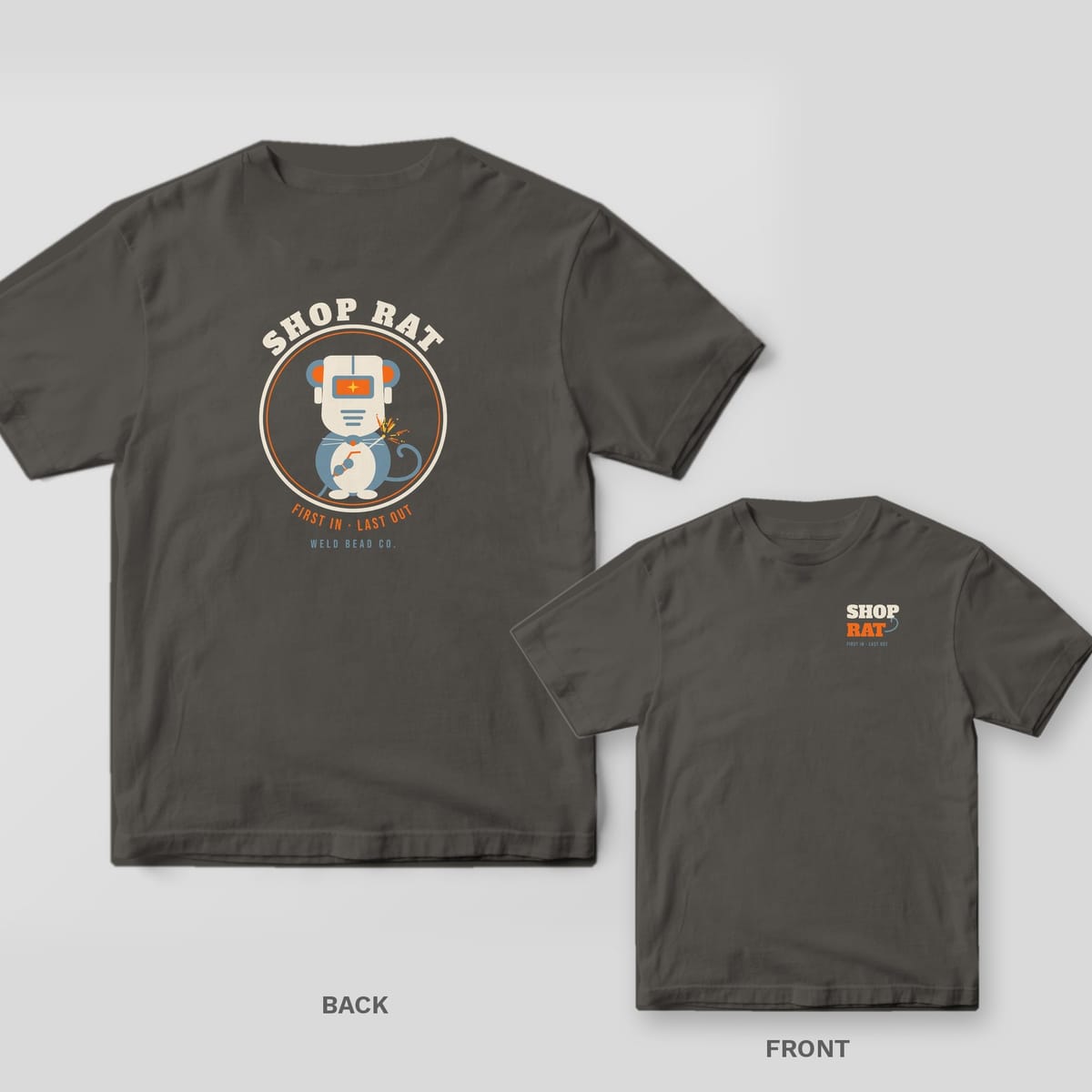 Shop Rat welder shirt shown back and front on Pepper Comfort Colors 1717: Round badge with a rat wearing a welding hood and holding a torch, "Shop Rat" arched above and "First In · Last Out" below