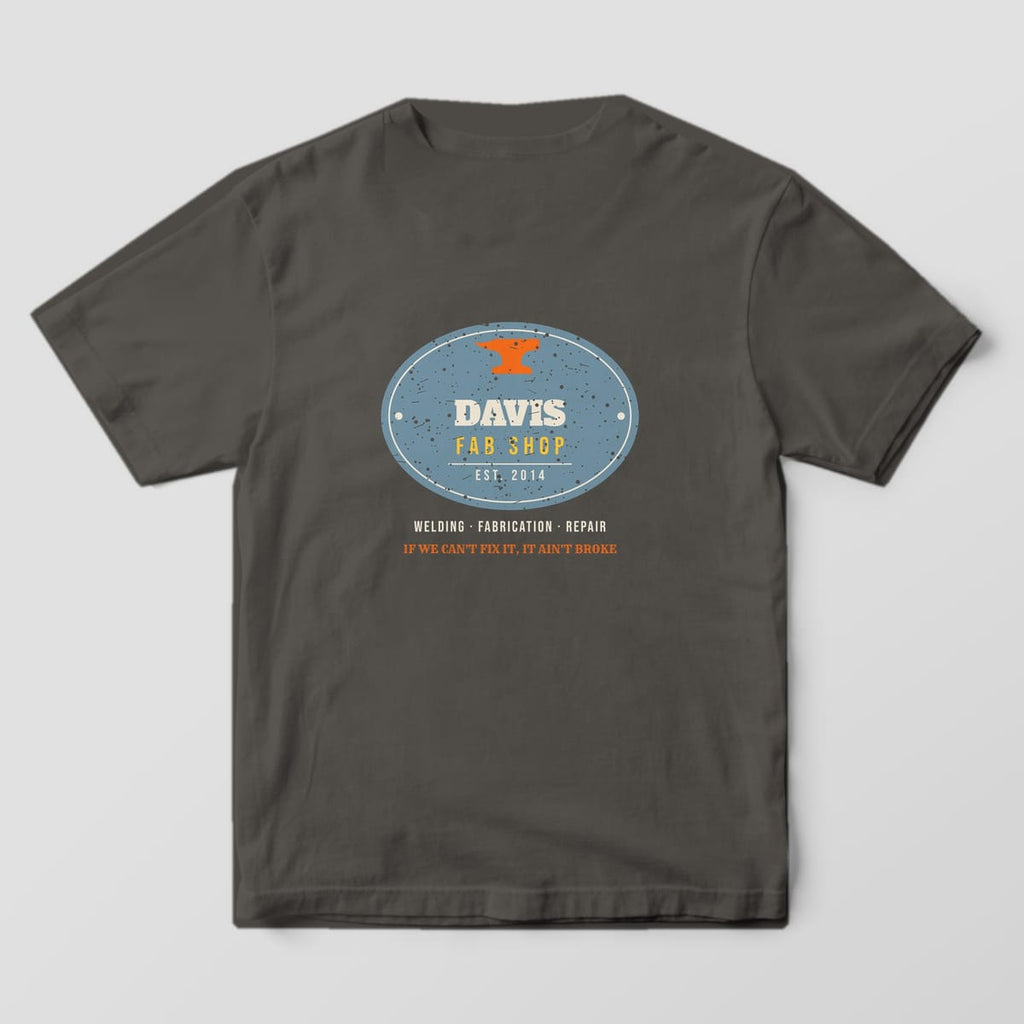 Back print on a Pepper Comfort Colors 1717 tee: Oval steel plate with an anvil, your shop name, "Fab Shop" and "Est." year, plus "Welding · Fabrication · Repair" and "If We Can't Fix It, It Ain't Broke"