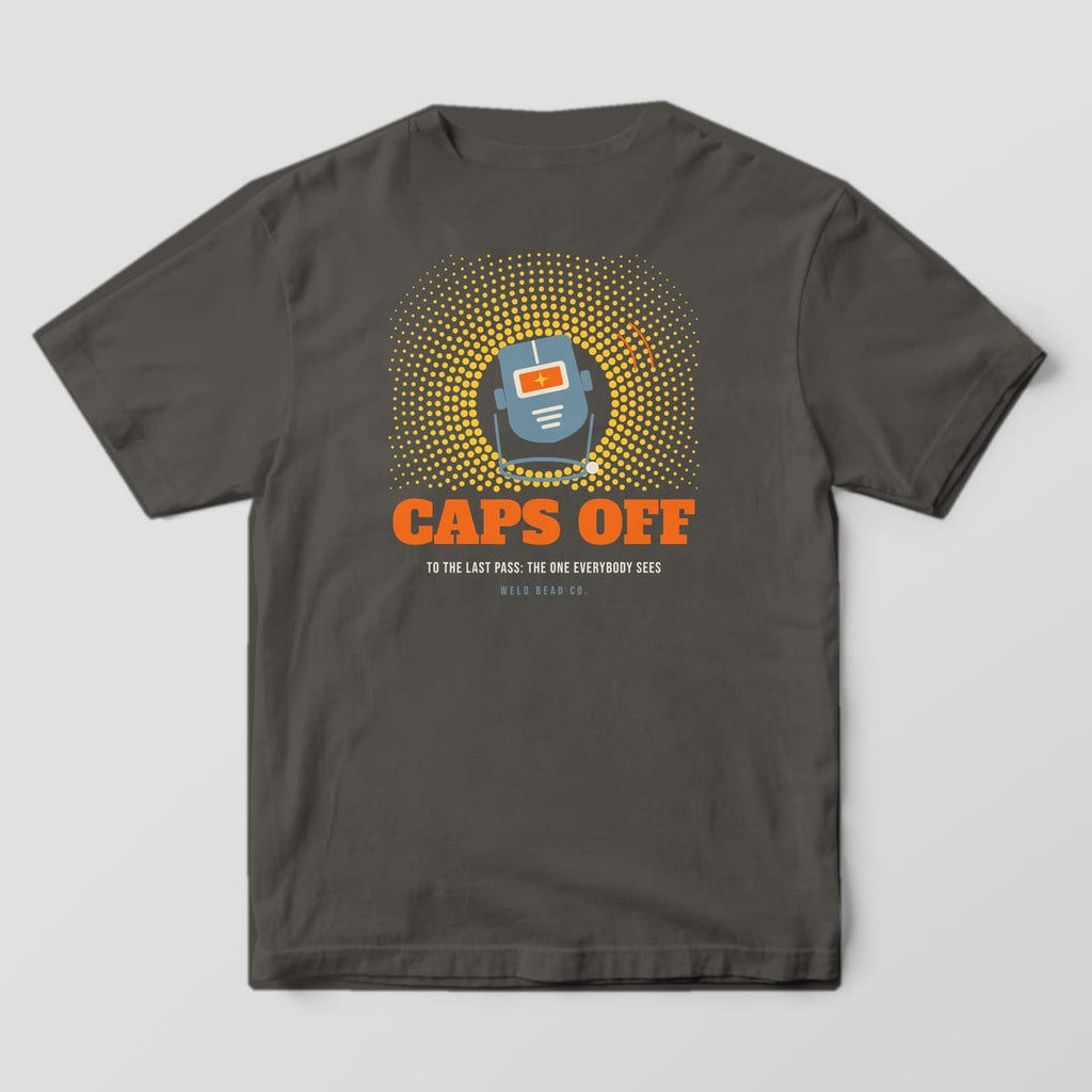 Back print on a Pepper Comfort Colors 1717 tee: A welding hood tipped up on its headgear in a halftone spark burst over "Caps Off" and "To the Last Pass: The One Everybody Sees"