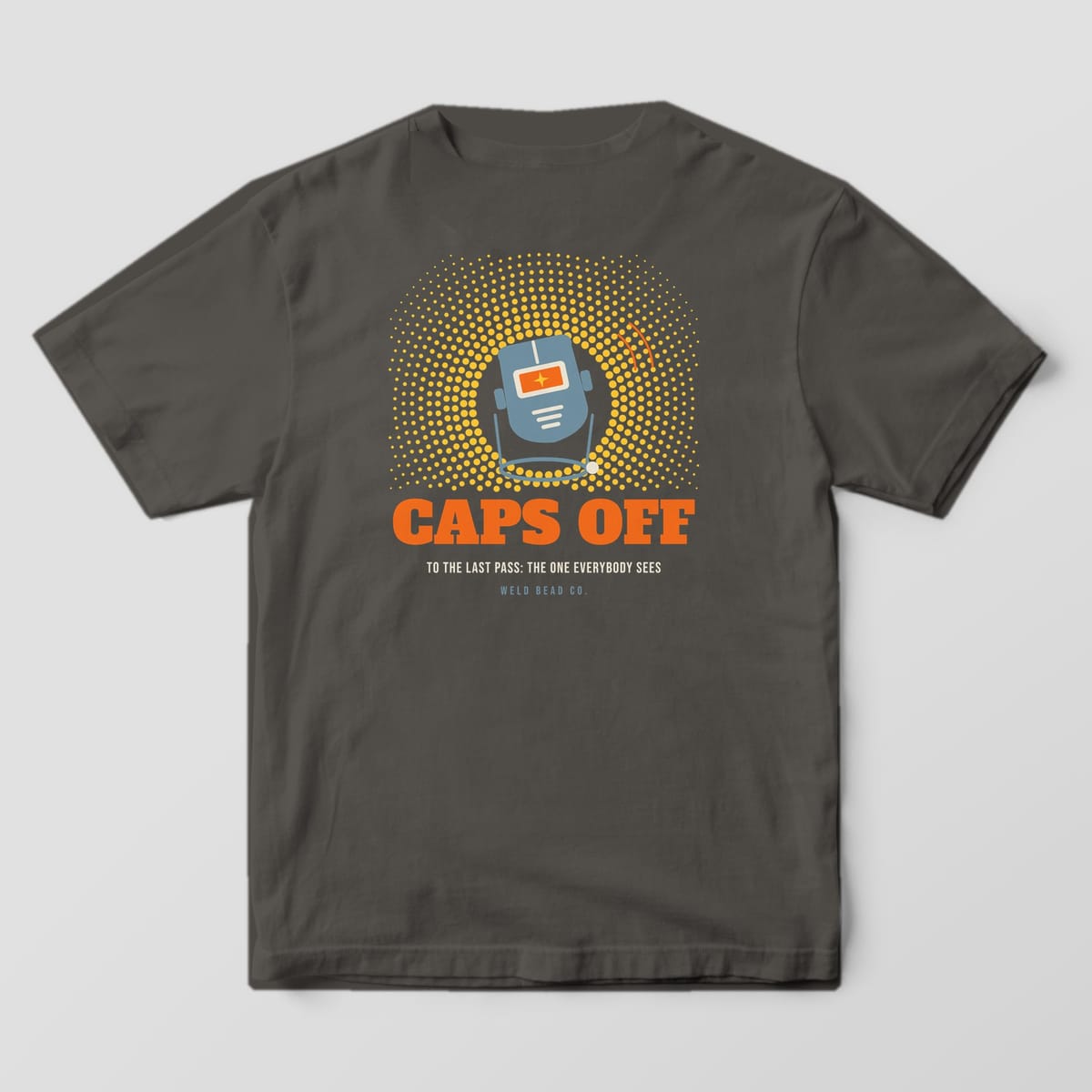 Back print on a Pepper Comfort Colors 1717 tee: A welding hood tipped up on its headgear in a halftone spark burst over "Caps Off" and "To the Last Pass: The One Everybody Sees"