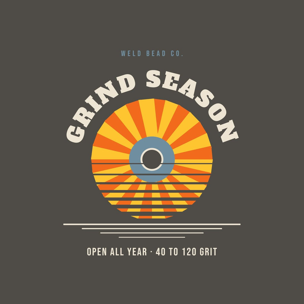 Close-up of the Grind Season print showing bone, arc orange and steel blue ink detail