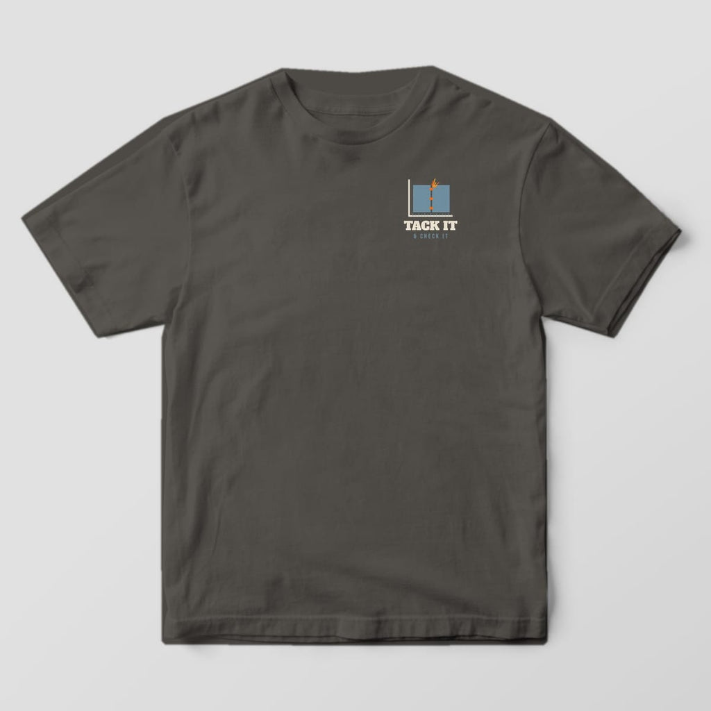 Front of the Pepper Comfort Colors 1717 tee showing the left-chest print: Small left-chest butt joint with three orange tacks against a framing square, with "Tack It & Check It"