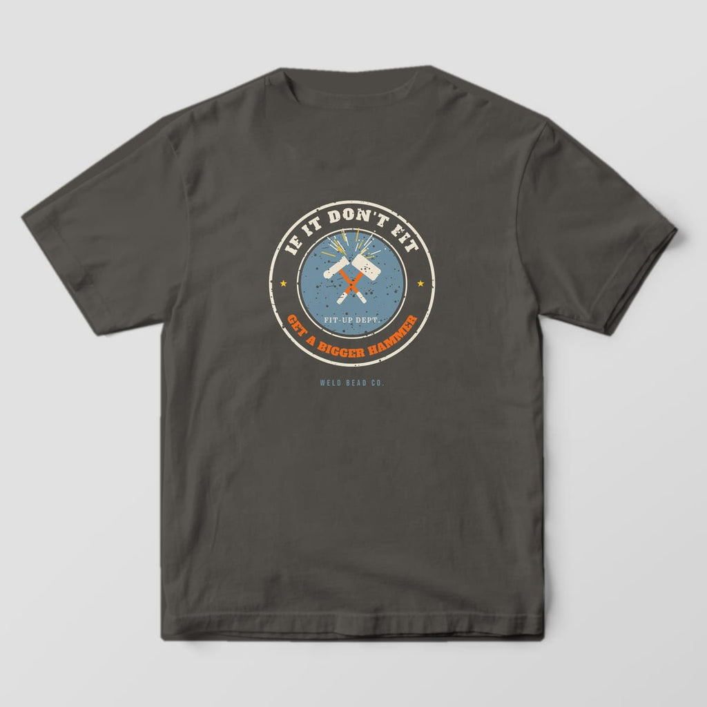 Back print on a Pepper Comfort Colors 1717 tee: Round distressed badge with crossed sledgehammers and sparks, "If It Don't Fit" above and "Get a Bigger Hammer" below